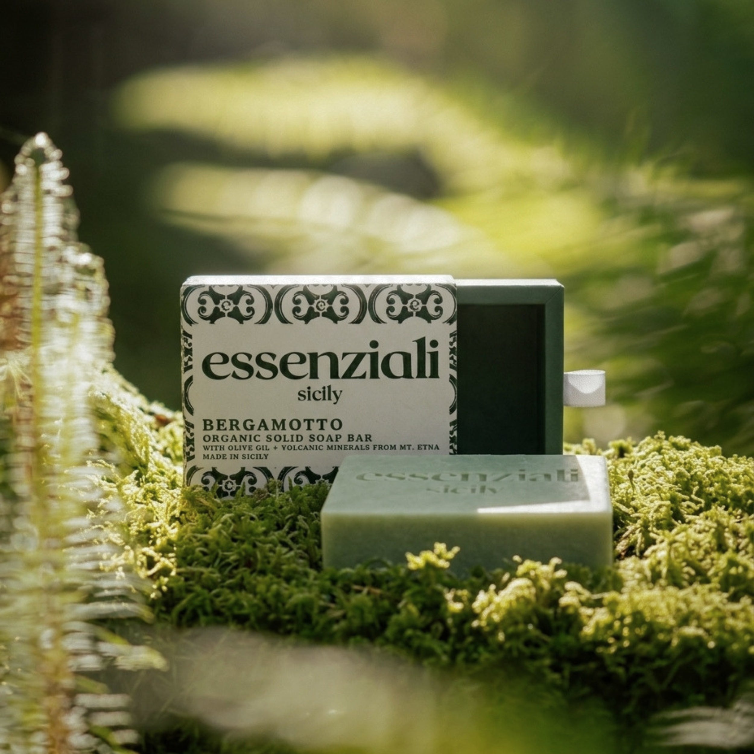 Essenziali soap bar with packaging on a natural background