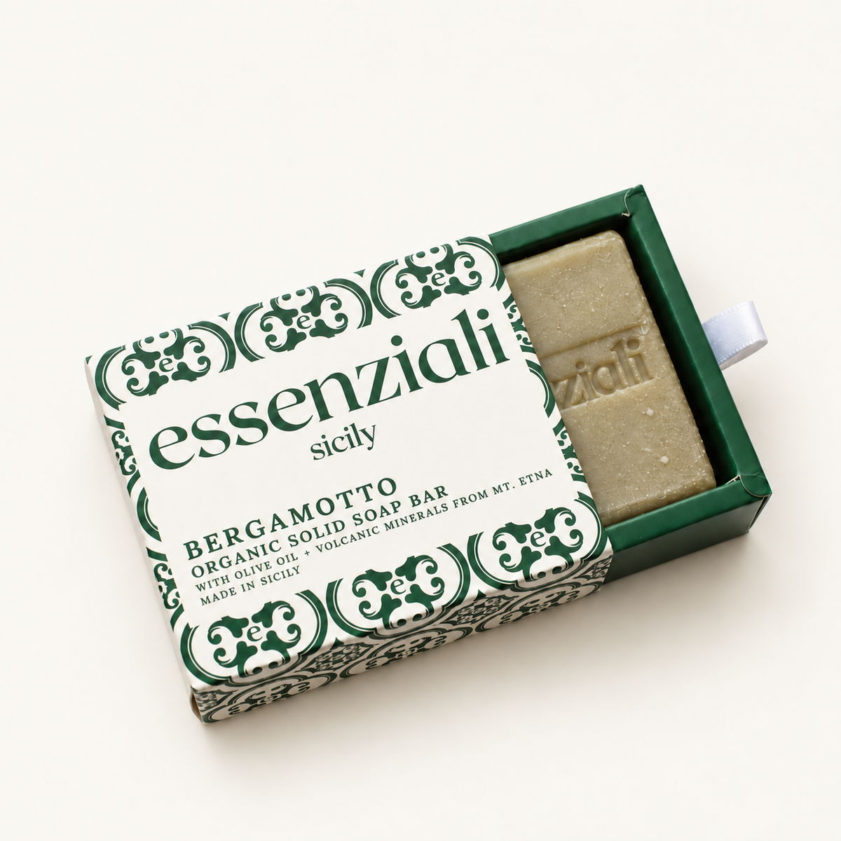 Essenziali Bergamotto soap in its partly opened patterned box on a cream background