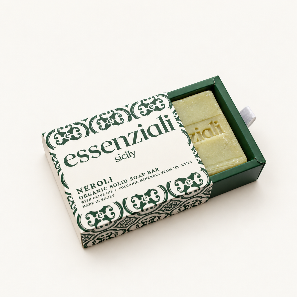 Essenziali Neroli soap in its partly opened patterned box on a cream background