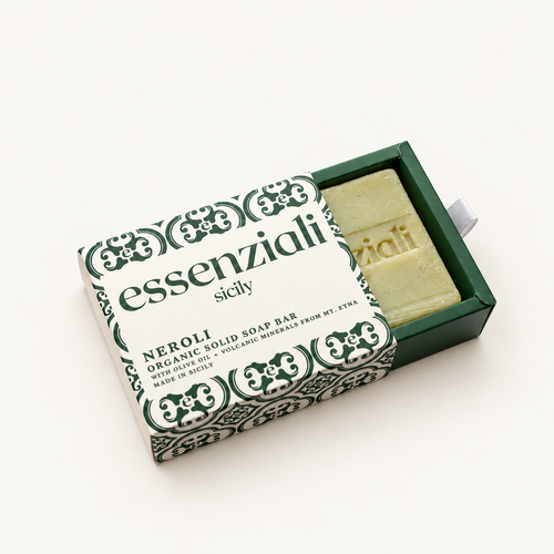 Essenziali Neroli soap in its partly opened patterned box on a cream background